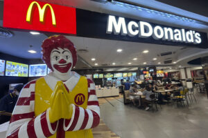 The image shows the mcdonalds resturant you can there find the McDonald’s menu with prices.