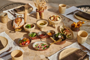 The image shows the best destination for food lovers. and in this image there is a lot of food items on the floor